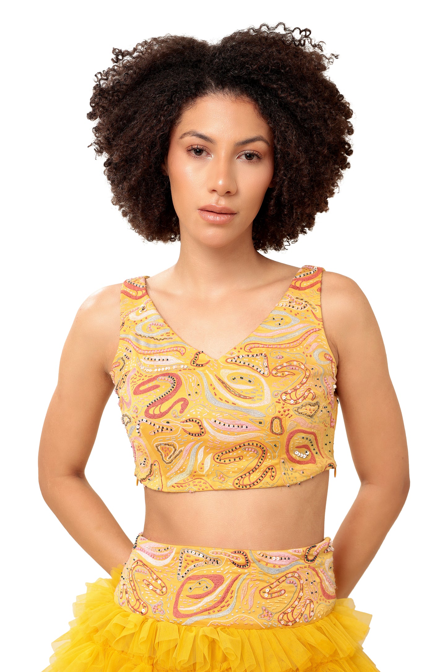 Modo Caldo yellow ruffled net lehenga and hand embellished crop top for mehendi haldi festive wear