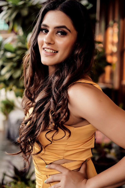 Arushi Handa in Modo Caldo yellow bodycon evening dress with sweetheart neckline and ruffles