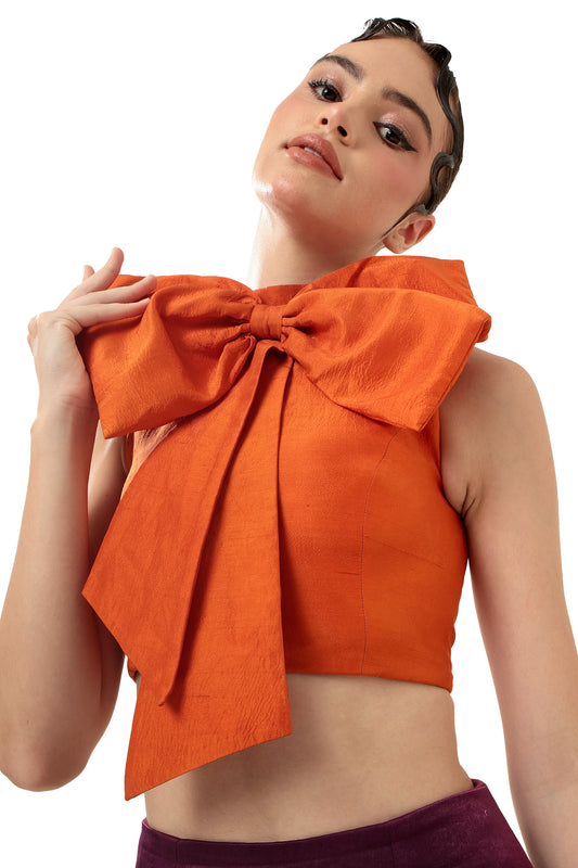 Modo Caldo sleeveless orange big bow crop top in silk with zero neck for casual wear and occasion wear