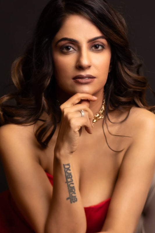 Kirti Sihag Chaudhary in Modo Caldo red peplum corset top with off-shoulder sleeves and matching boot-cut trousers for Mrs. Voguestar