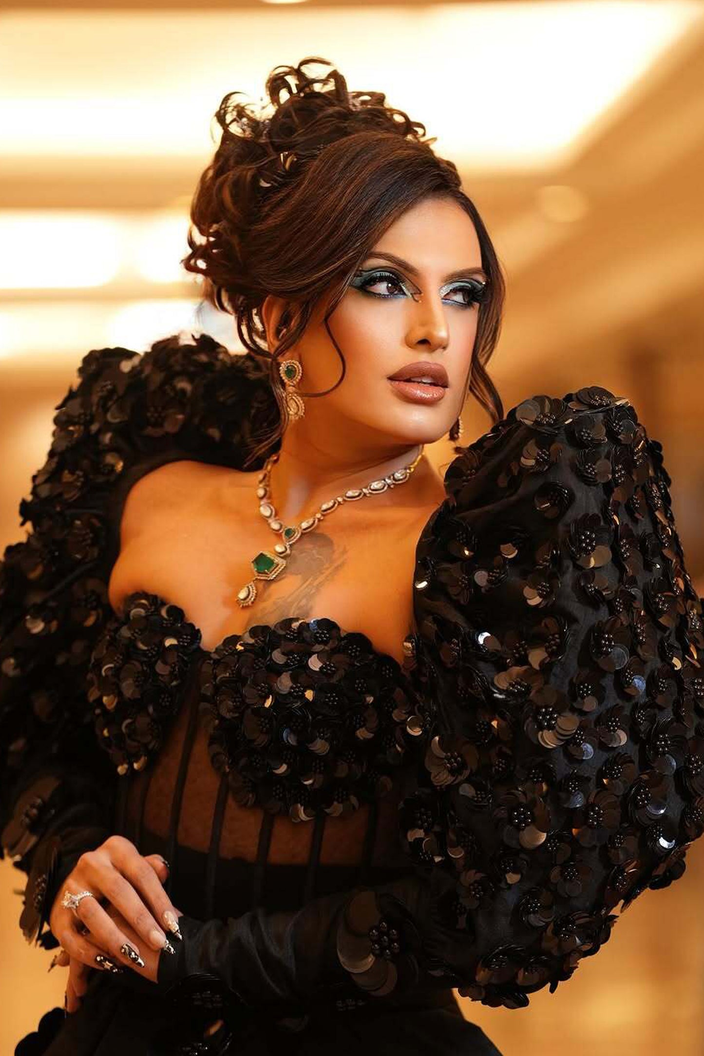 Rani Kohenur in custom Modo Caldo black corset with zardosi floral applique and asymmetric peplum skirt for formal occasions