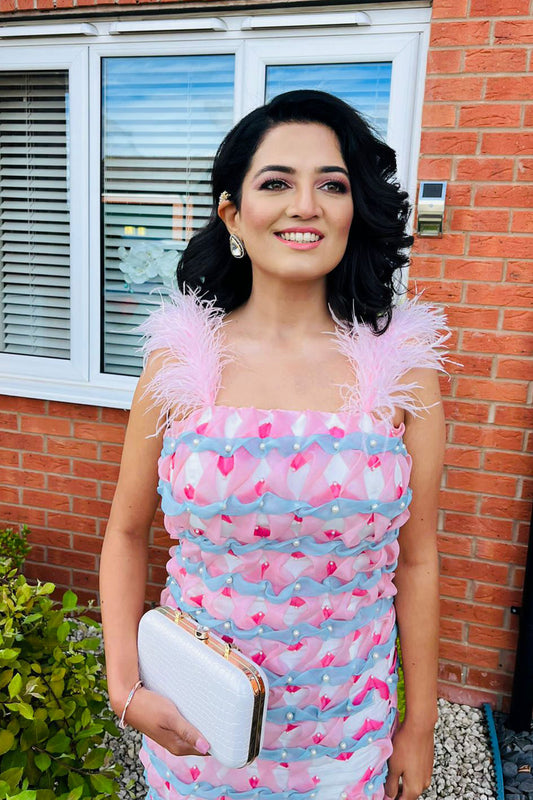 Namrata Senani in Modo Caldo custom white bodycon dress with hand-embroidered organza strips and feathered straps for formal occasions