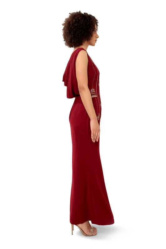 Modo Caldo deep red sleeveless bodycon maxi dress with hand embroidered metallic zari embellishments broad round neck with cowl drape back and side slit for evening wear and occasion wear