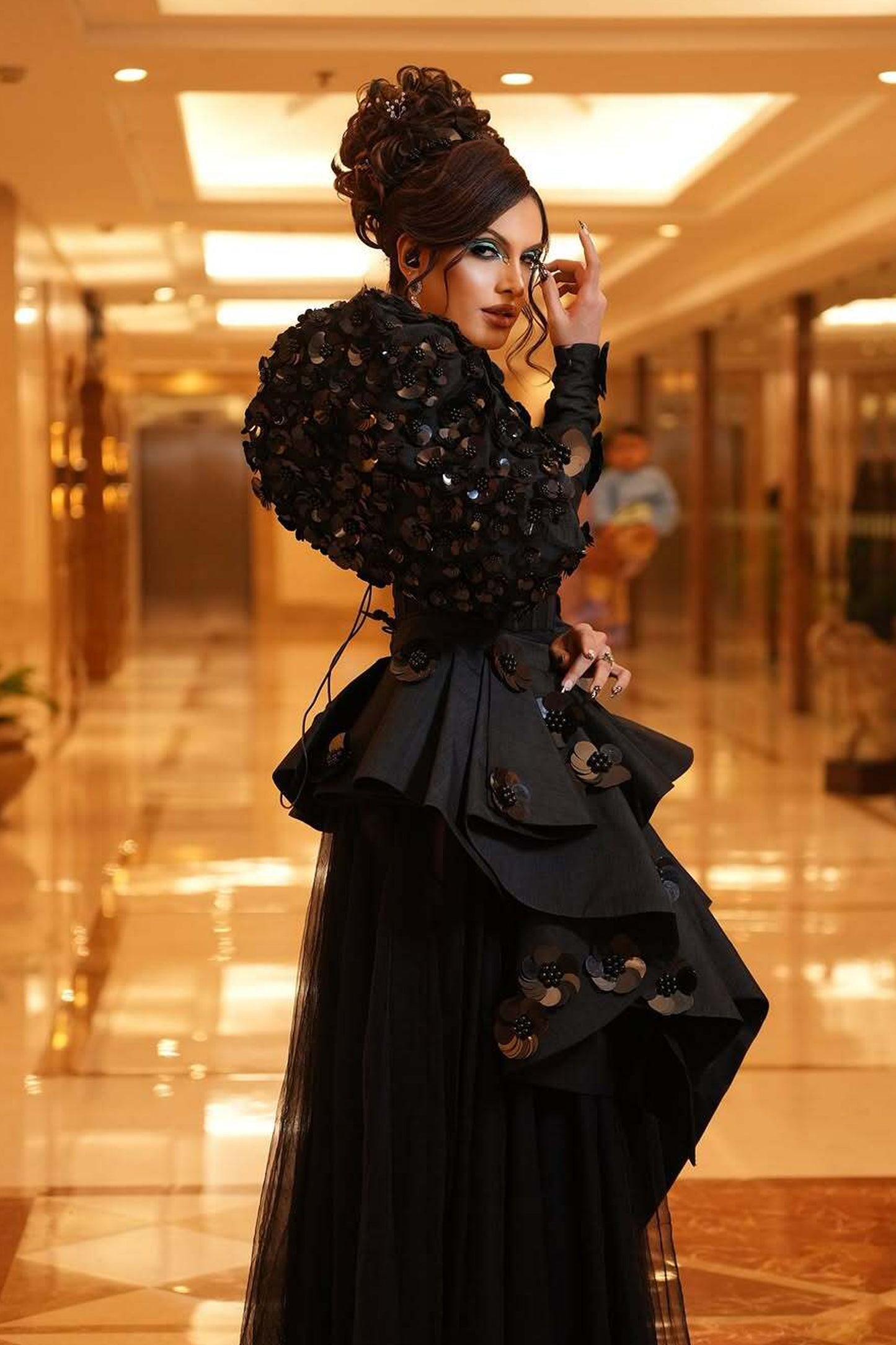 Rani Kohenur in custom Modo Caldo black corset with zardosi floral applique and asymmetric peplum skirt for formal occasions