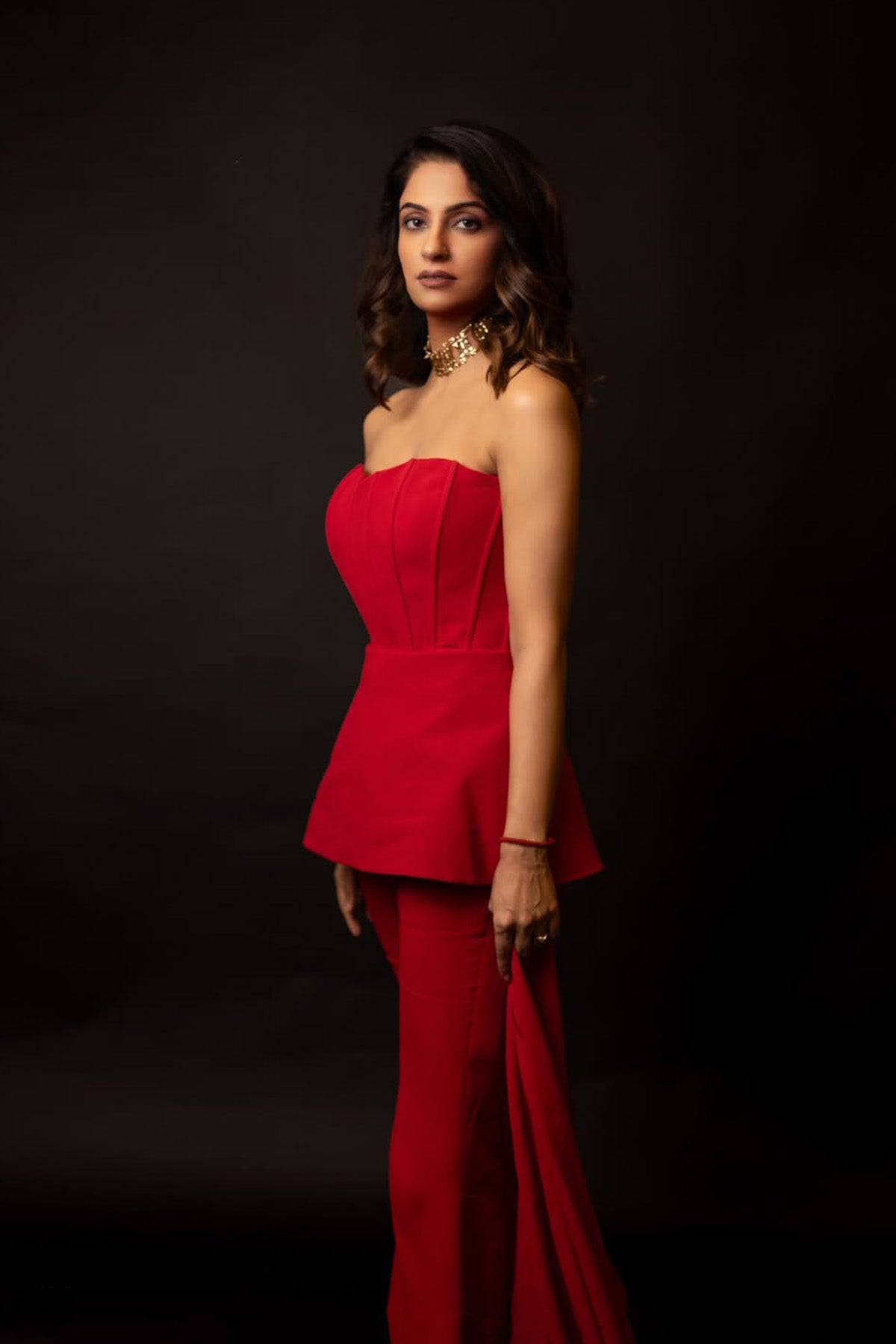 Kirti Sihag Chaudhary in Modo Caldo red peplum corset top with off-shoulder sleeves and matching boot-cut trousers for Mrs. Voguestar