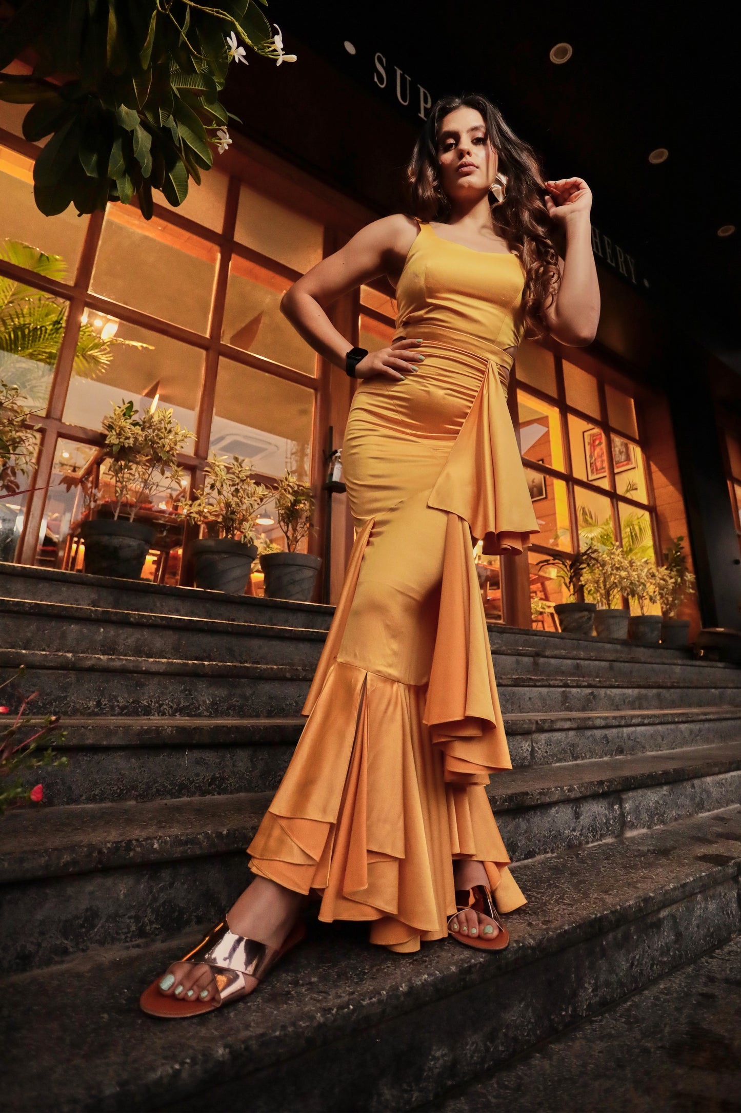 Arushi Handa in Modo Caldo yellow bodycon evening dress with sweetheart neckline and ruffles
