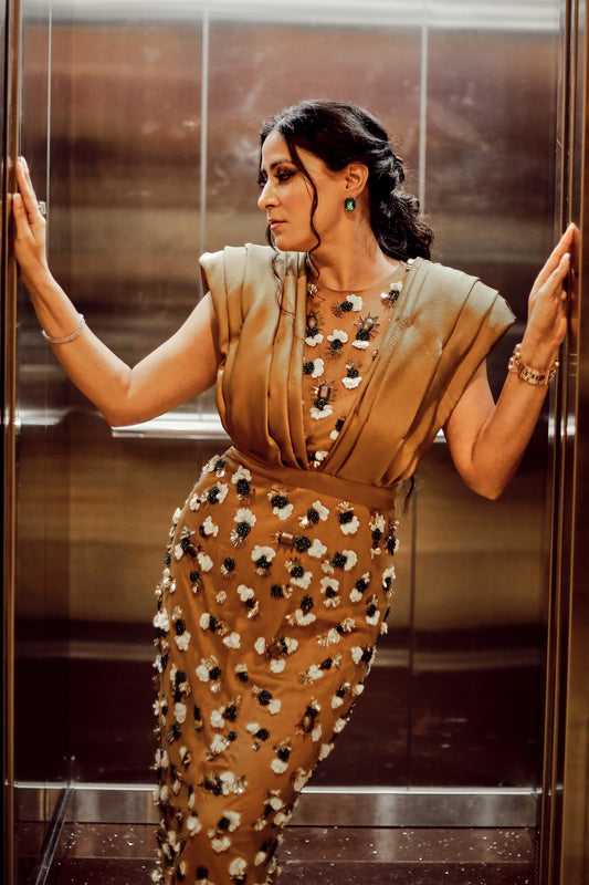 Isha Sharma wearing Modo Caldo copper brown bodycon dress with hand-embroidery and sculpted shoulders for Mrs. International Supermodel