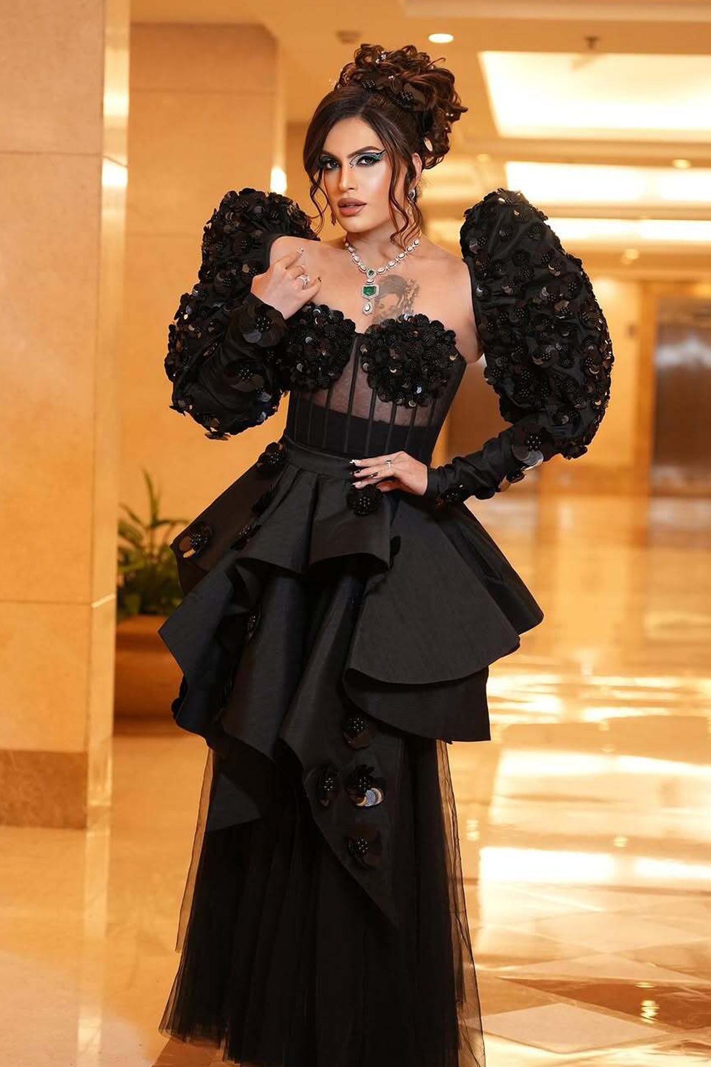 Rani Kohenur in custom Modo Caldo black corset with zardosi floral applique and asymmetric peplum skirt for formal occasions