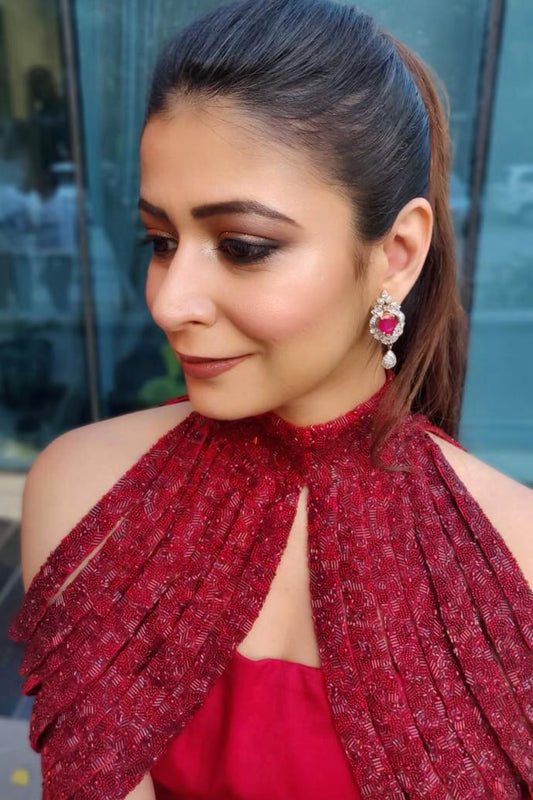 Freshia in Modo Caldo red fit-and-flare gown with padded bodice, straight neckline, hand-embroidered embellishments, and dramatic cape collar for evening and festive wear