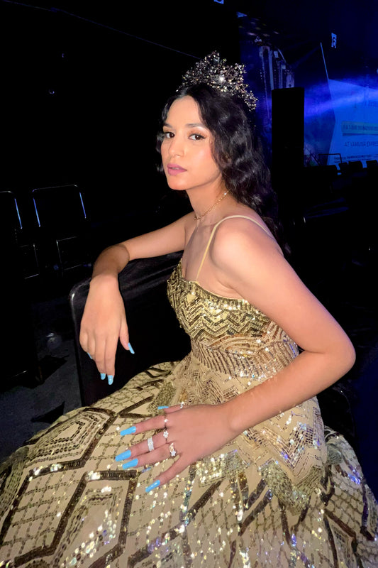 Ekta Singh wearing Modo Caldo green and gold georgette fit and flare cocktail gown with geometric embroidery and noodle straps for Miss International Supermodel Pageant