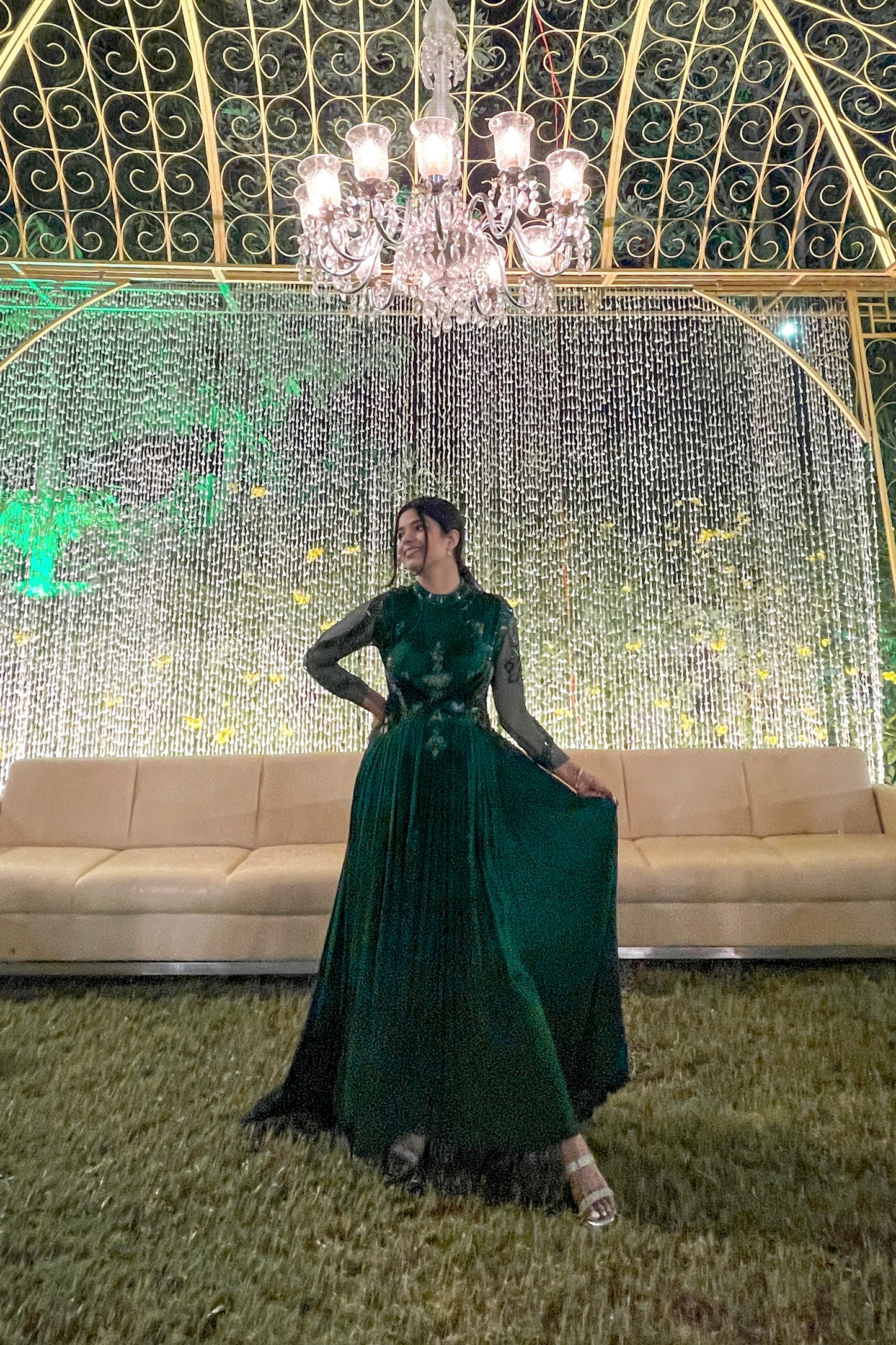 Mahi Bakshi in custom Modo Caldo dark green fit-and-flare gown with hand embroidery full sleeves and zero neck for weddings and cocktails