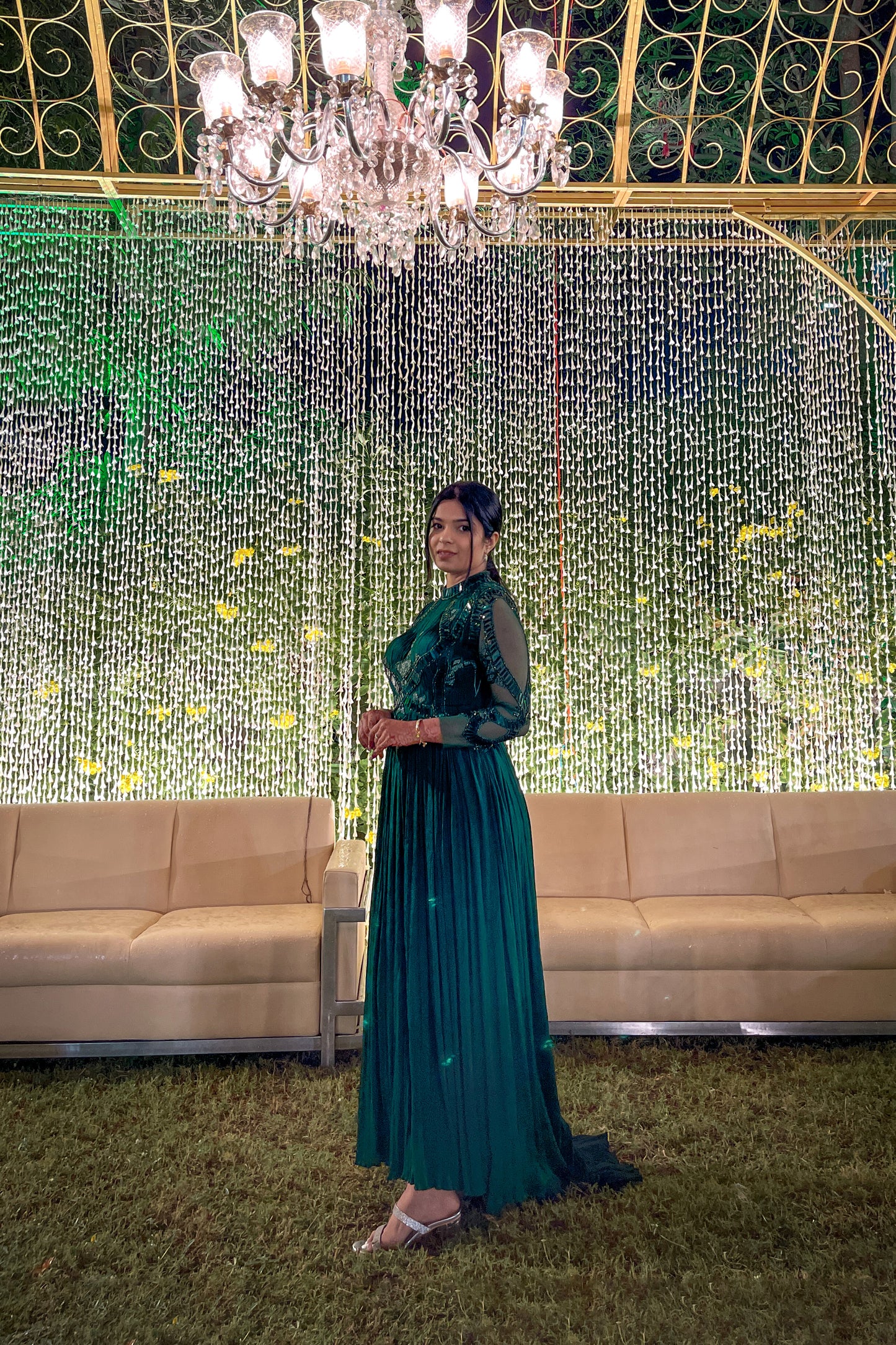 Mahi Bakshi in custom Modo Caldo dark green fit-and-flare gown with hand embroidery full sleeves and zero neck for weddings and cocktails