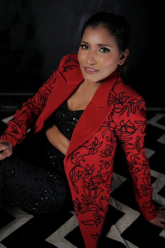 Likhitha Basepogu wearing Modo Caldo red textured blazer with hand-corded embroidery and black embellished boot-cut pants for Mrs Universe