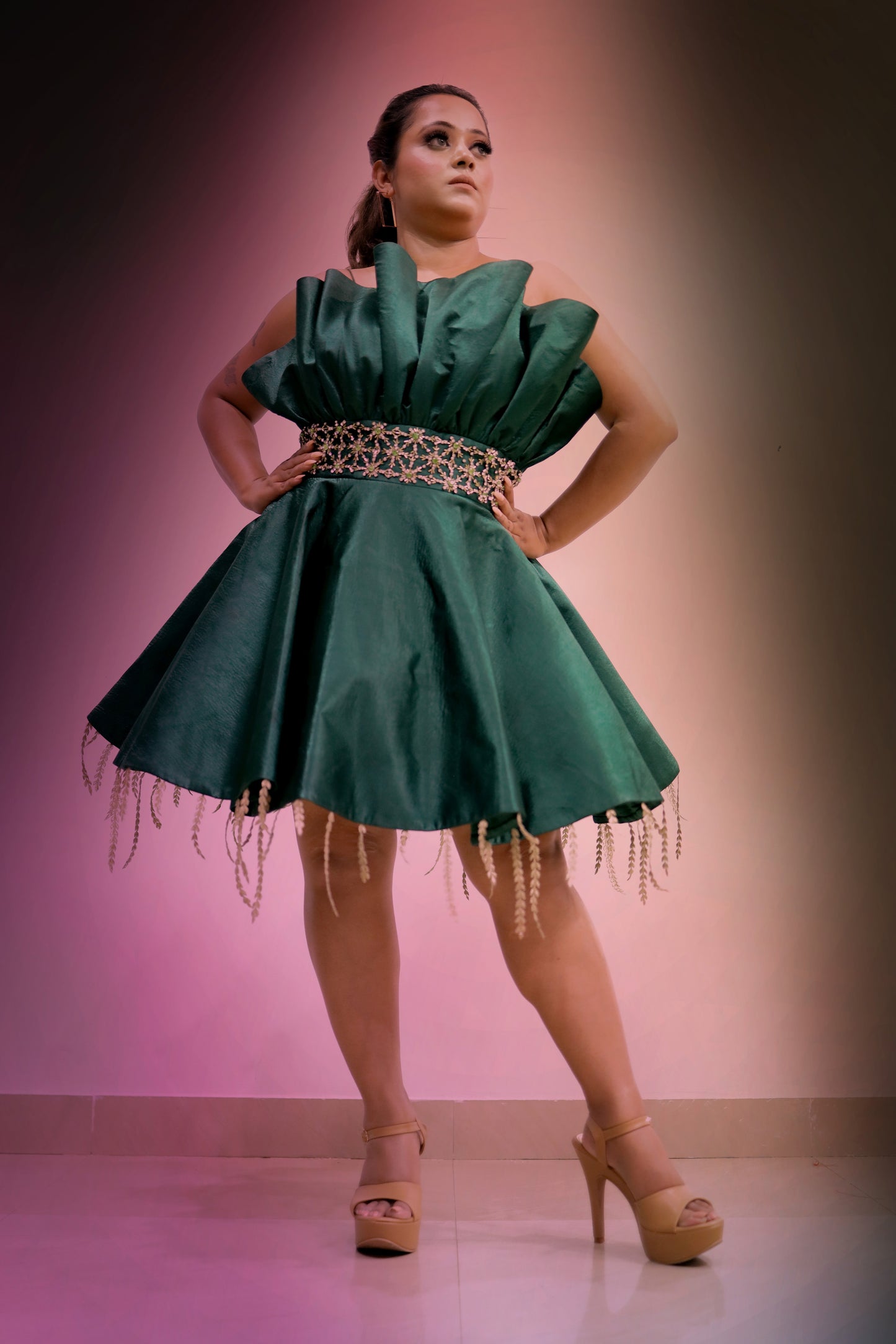 Asmita Dutta wearing Modo Caldo emerald green off-shoulder fit-and-flare dress with stonework embroidery and leaf details for Mrs. India Legacy Pageant