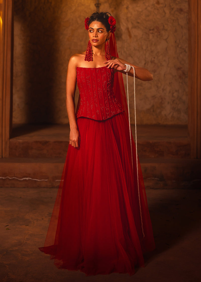 ISHQe campaign: red corset top and long red tulle skirt with a beaded veil