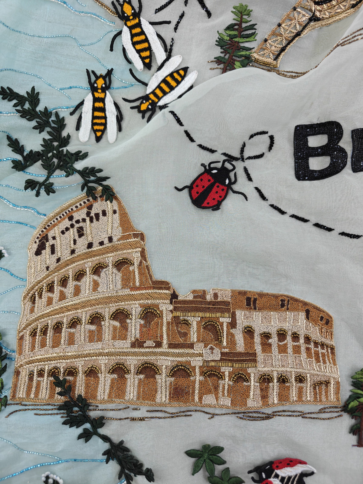 Embroidered Colosseum, bees and a ladybird on the Natkhat Zindagi gown