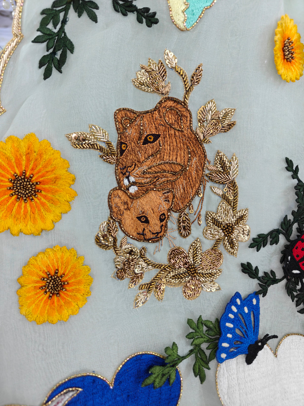 Embroidered lion cub with sunflowers on the Natkhat Zindagi gown