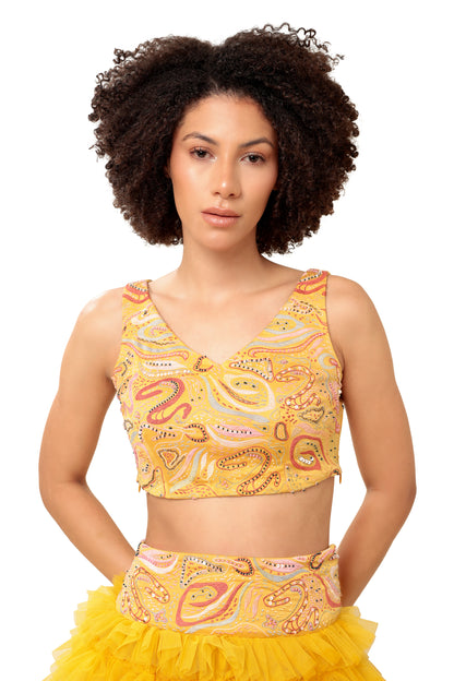Modo Caldo yellow ruffled net lehenga and hand embellished crop top for mehendi haldi festive wear