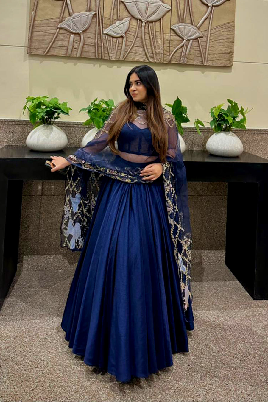 Rose Kawatra in Modo Caldo navy blue fit-and-flare corset lehenga set with embroidered corset and sheer tulle dupatta for festive and formal occasions