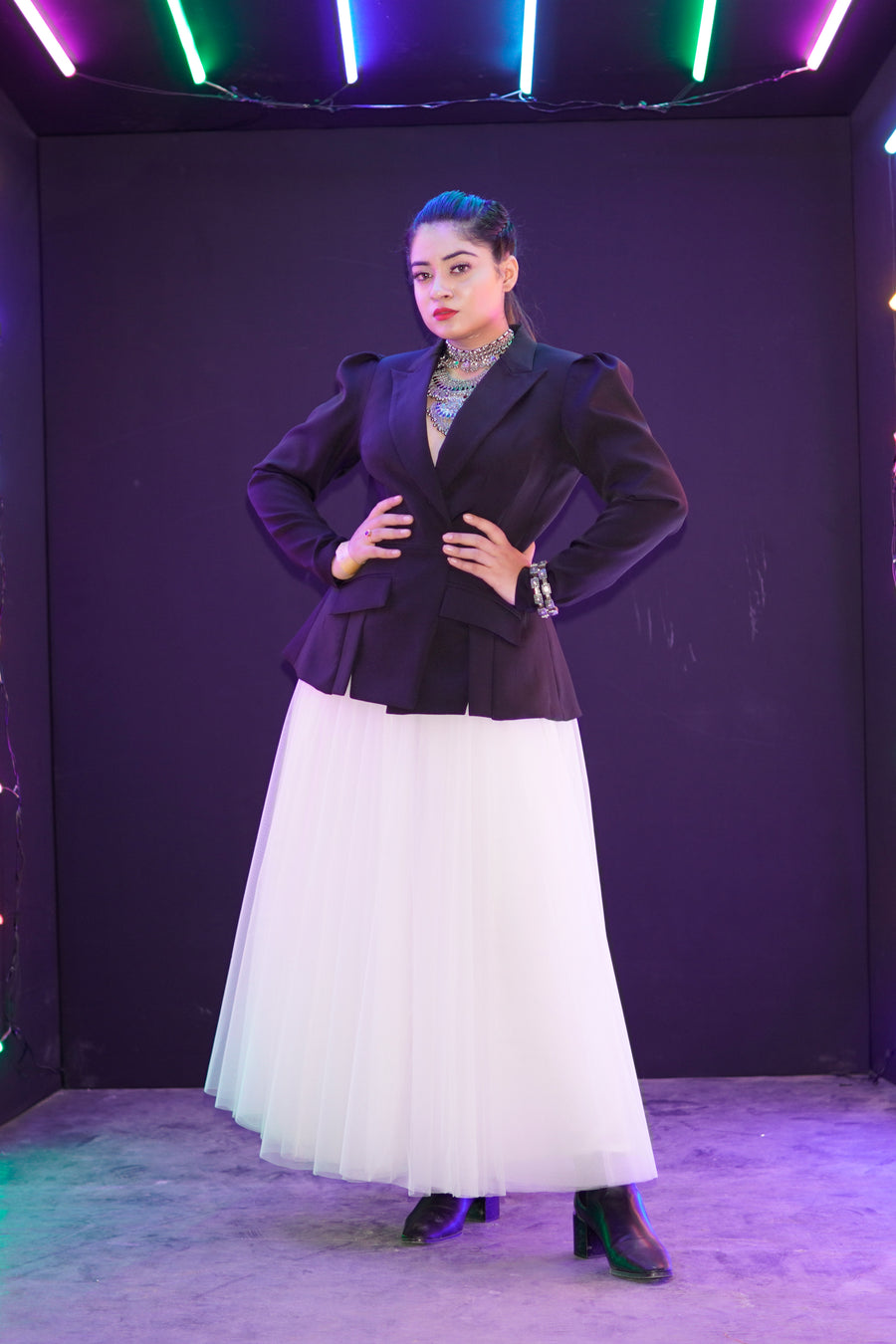 Rose Kawatra in  Modo Caldo black backless hourglass blazer with white flared tulle skirt elegant set for formal and evening occasions