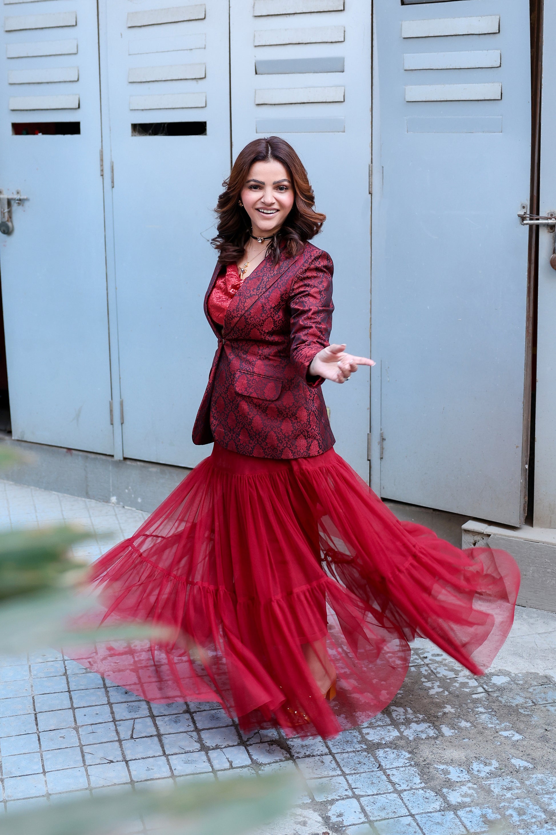 Rubina Dilaik in Modo Caldo red hourglass blazer with sheer A-line tulle skirt styled for formal and pageant occasions