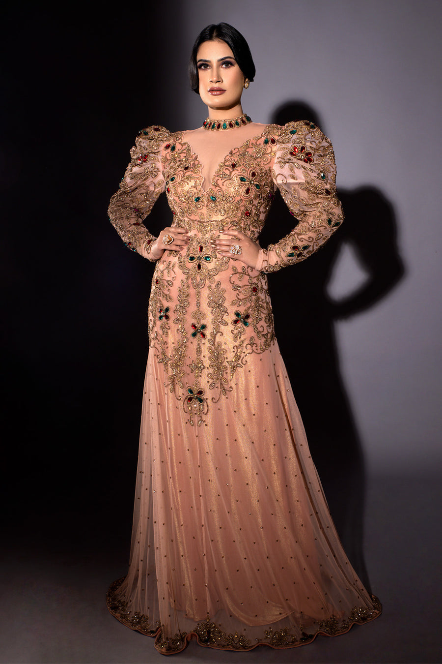 Pageant Mentor Preeti Vashishth in Modo Caldo rose gold fit and flare mermaid gown with floral zardosi embroidery deep plunge neckline and puffed sleeves