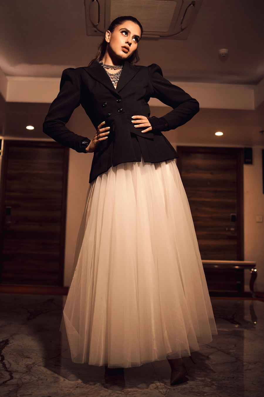 Arushi Handa in Modo Caldo black backless blazer with big white tulle flared skirt for all occasions