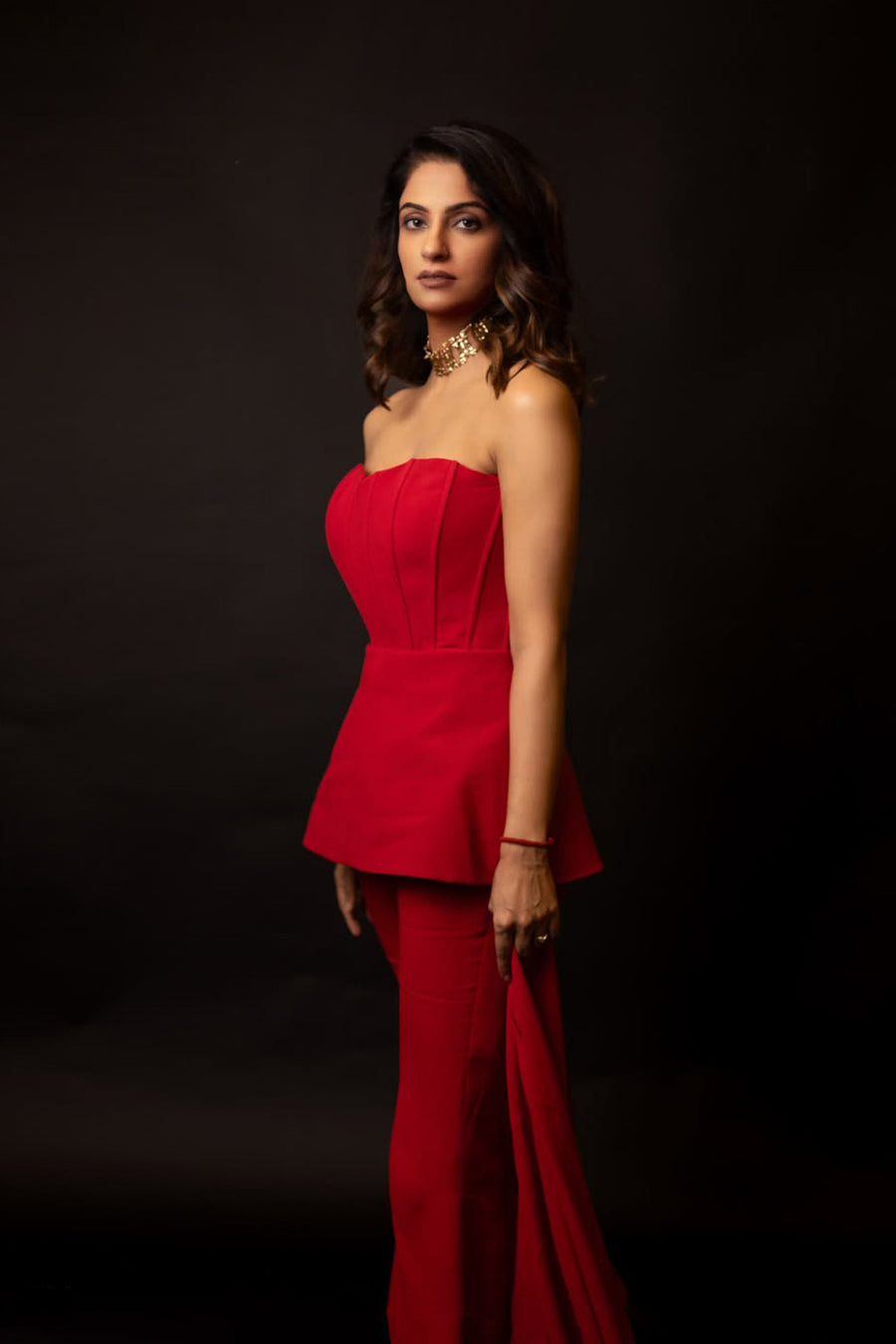 Kirti Sihag Chaudhary in Modo Caldo red peplum corset top with off-shoulder sleeves and matching boot-cut trousers for Mrs. Voguestar