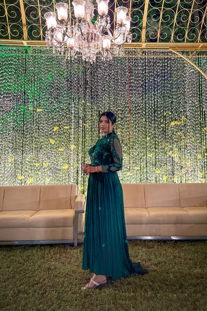 Mahi Bakshi in custom Modo Caldo dark green fit-and-flare gown with hand embroidery full sleeves and zero neck for weddings and cocktails