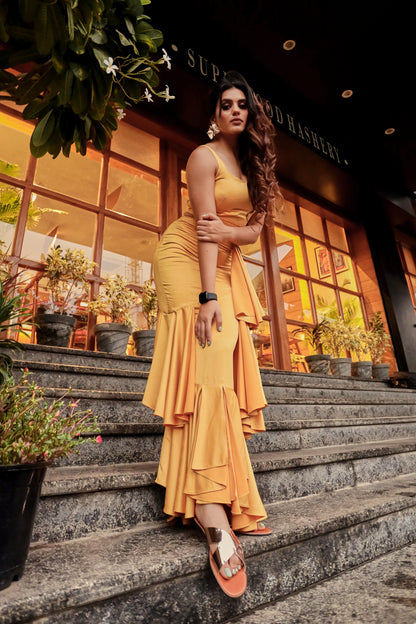 Arushi Handa in Modo Caldo yellow bodycon evening dress with sweetheart neckline and ruffles